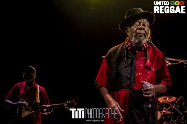 U-Roy performing live with a microphone in Grenoble in 2015