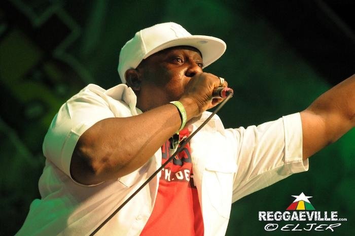 U-Roy performing onstage with a microphone at Rototom Sunsplash in 2013