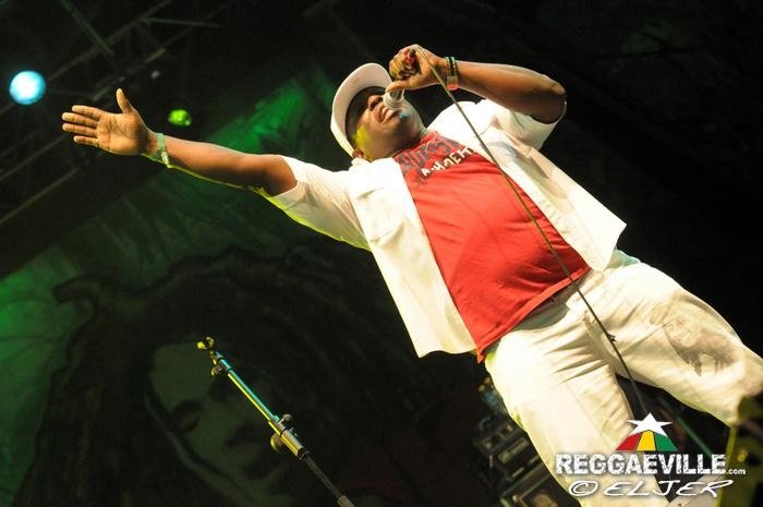 U-Roy onstage at Rototom Sunsplash in 2013 holding a microphone
